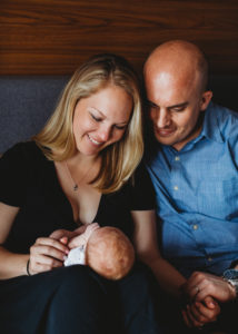 parents gazing at their newborn baby