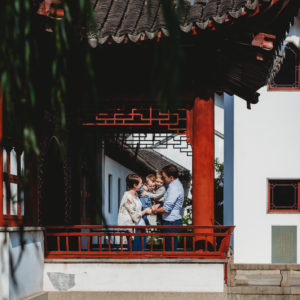 a family portrait in a Chinese garden
